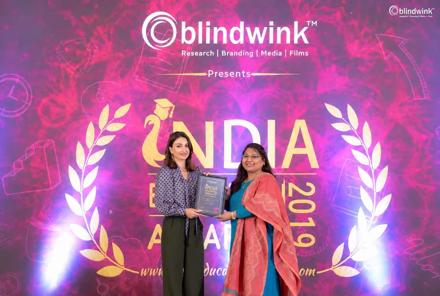 Pushpavalli receiving her award at the India Education Awards in 2019.