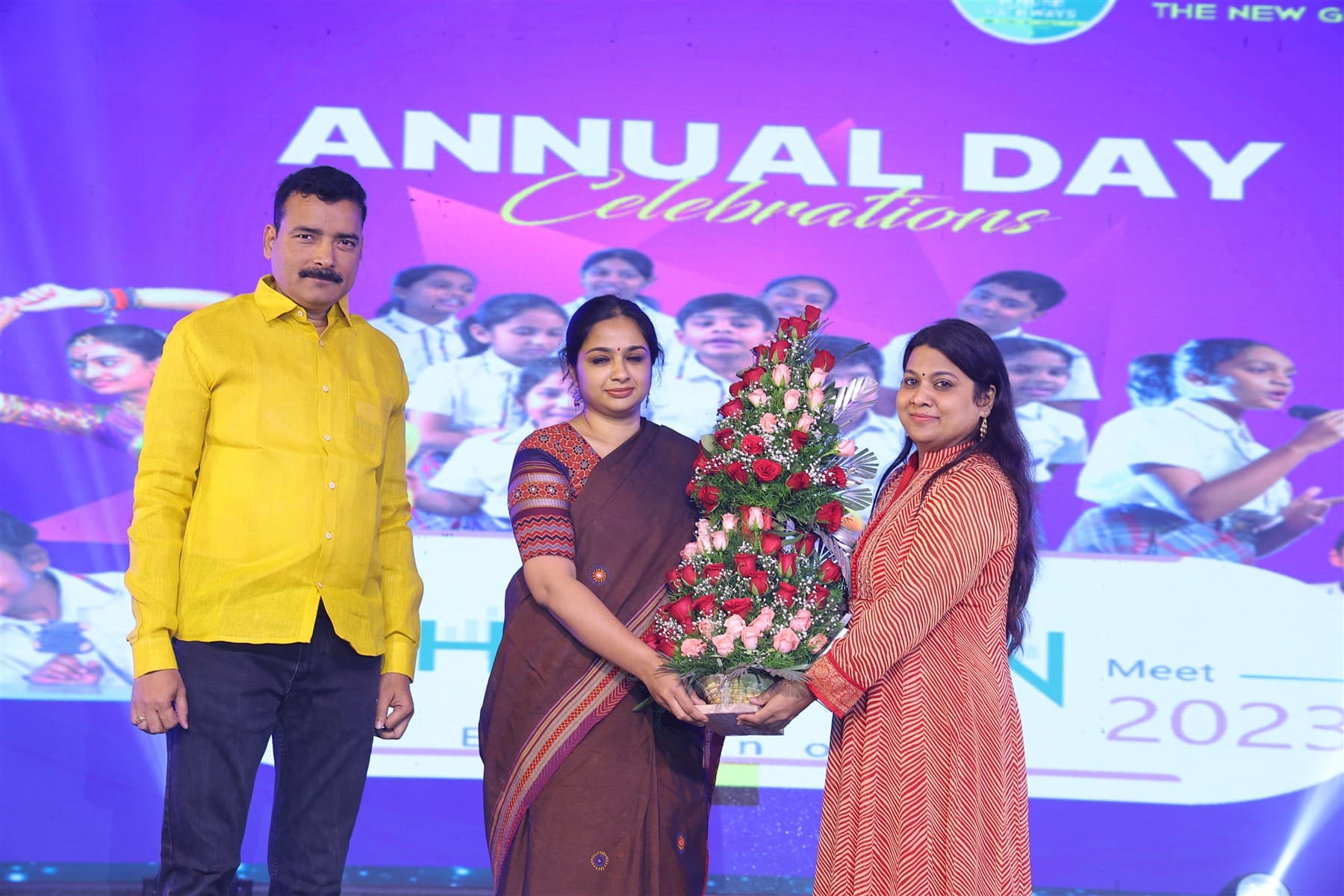 Pushpavalli with education leaders at a community gathering.